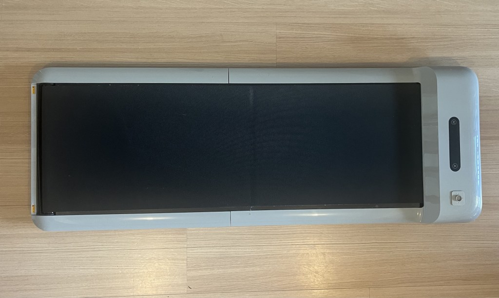 Photo of the kingsmith c2 walking pad unfolded on the floor.