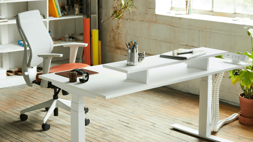Photo of an ergonomic desk chair and standing desk